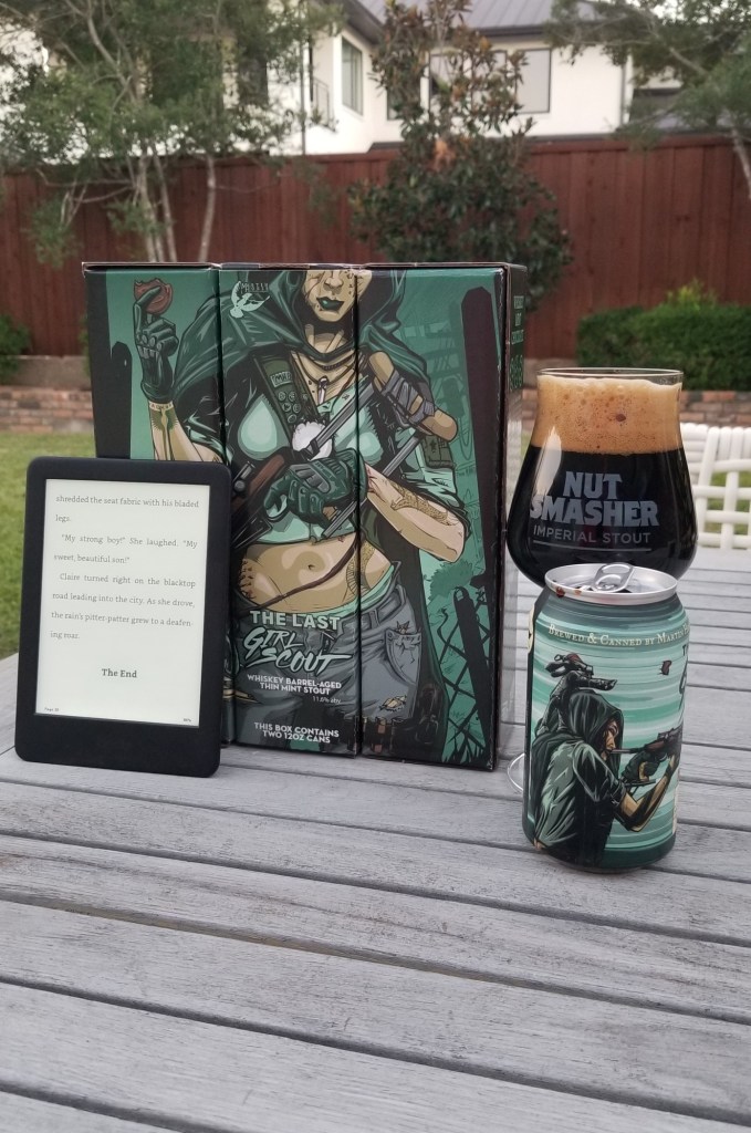 Photo of the Kindle showing the last page of "The Hay Bale" and a Halloween Themed Stout.