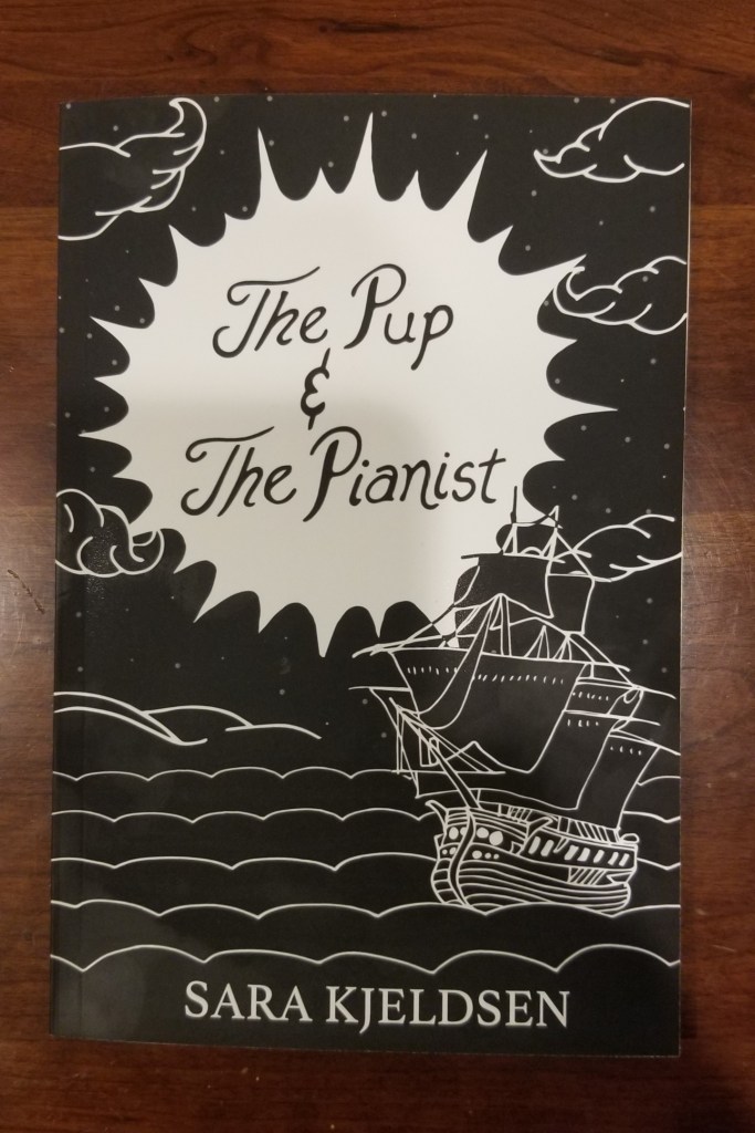Photo of the front cover of The Pup and The Pianist by Sara Kjeldsen. Click on the image to go to the Amazon.com page for the paperback version.
