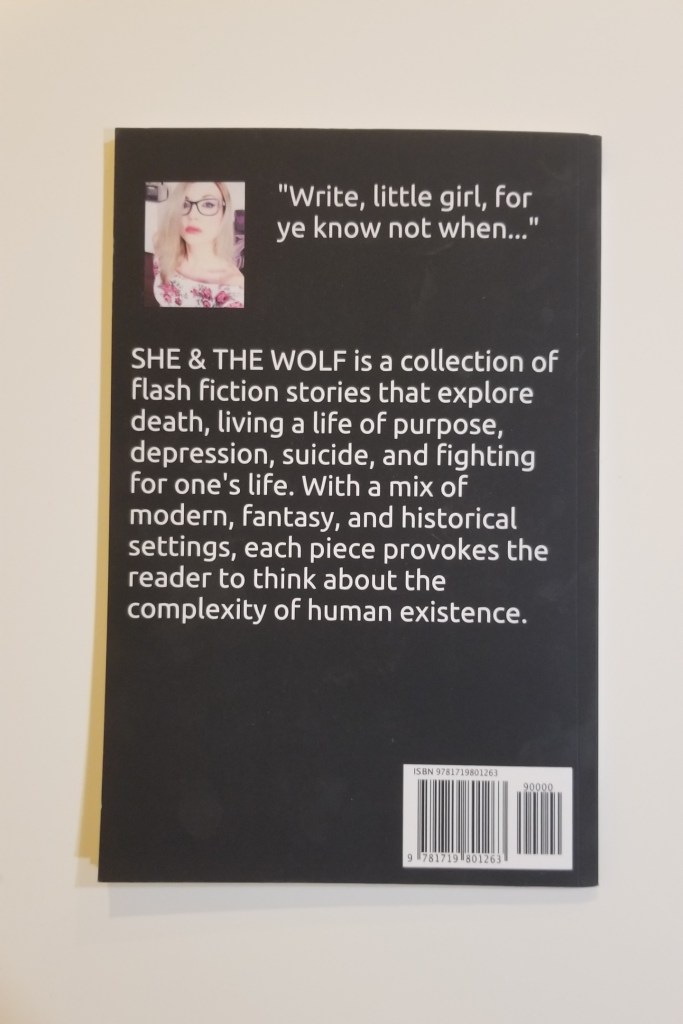 Photo of the back cover of the book She and The Wolf by Sara Kjeldsen.