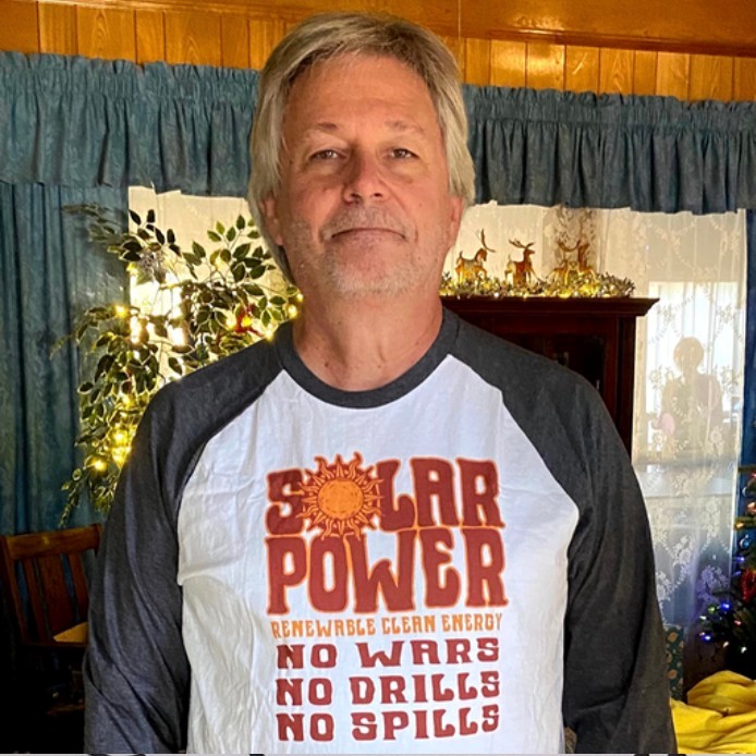 Larry Howe a leader in Citizens Climate Lobby in his solar power shirt.
