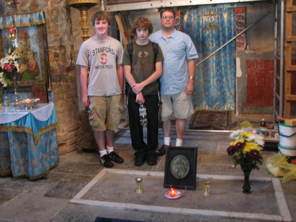 Photo of three of us standing right behind Dracula's grave on the Snagov island. I am to the right in blue, my son in the middle. I forgot his friend’s name. Dracula’s monk took the photo using my camera. Focus could have been better.