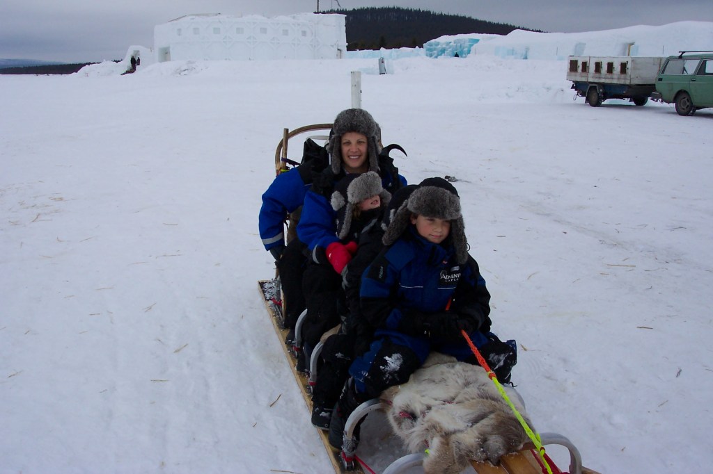 My wife Claudia and our three kids in a dogsled.