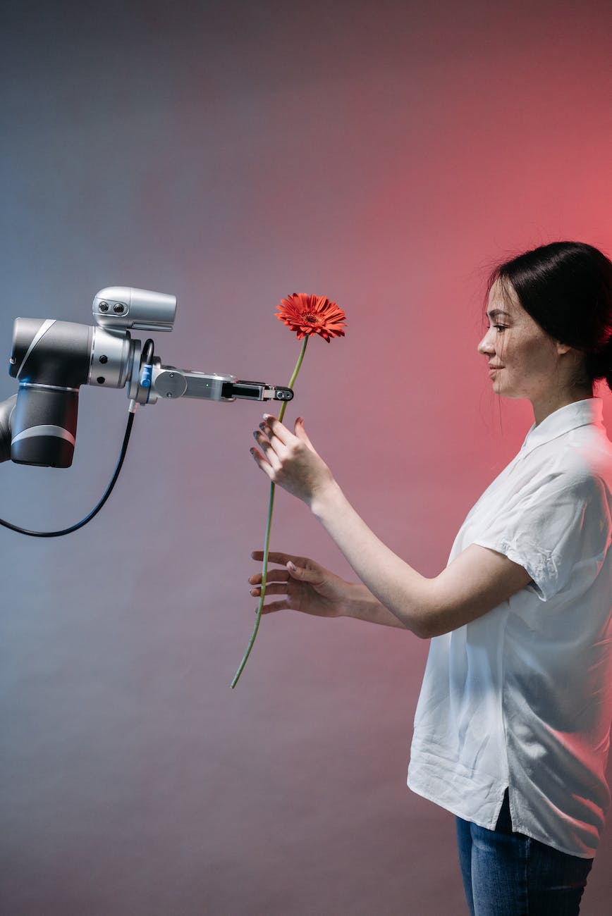 Robot giving a woman a flower 