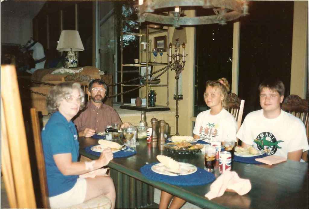 We are sitting around a dinner table.