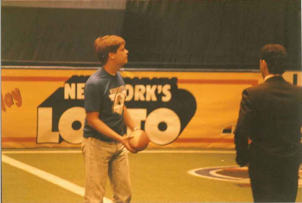Me holding a football in the arena at Madison Square Garden.