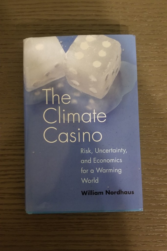 The blue front cover of the book The Climate Casino: Risk, Uncertainty, and Economics for a Warming World by Nobel Prize Winner in economics William Nordhaus. Click on the picture to go to the Amazon location for the hardcover of the book.