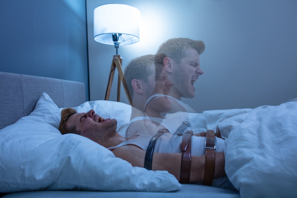 Photo from iStock photos purchased for 12 dollars. It shows a restrained man trying to get up from bed.