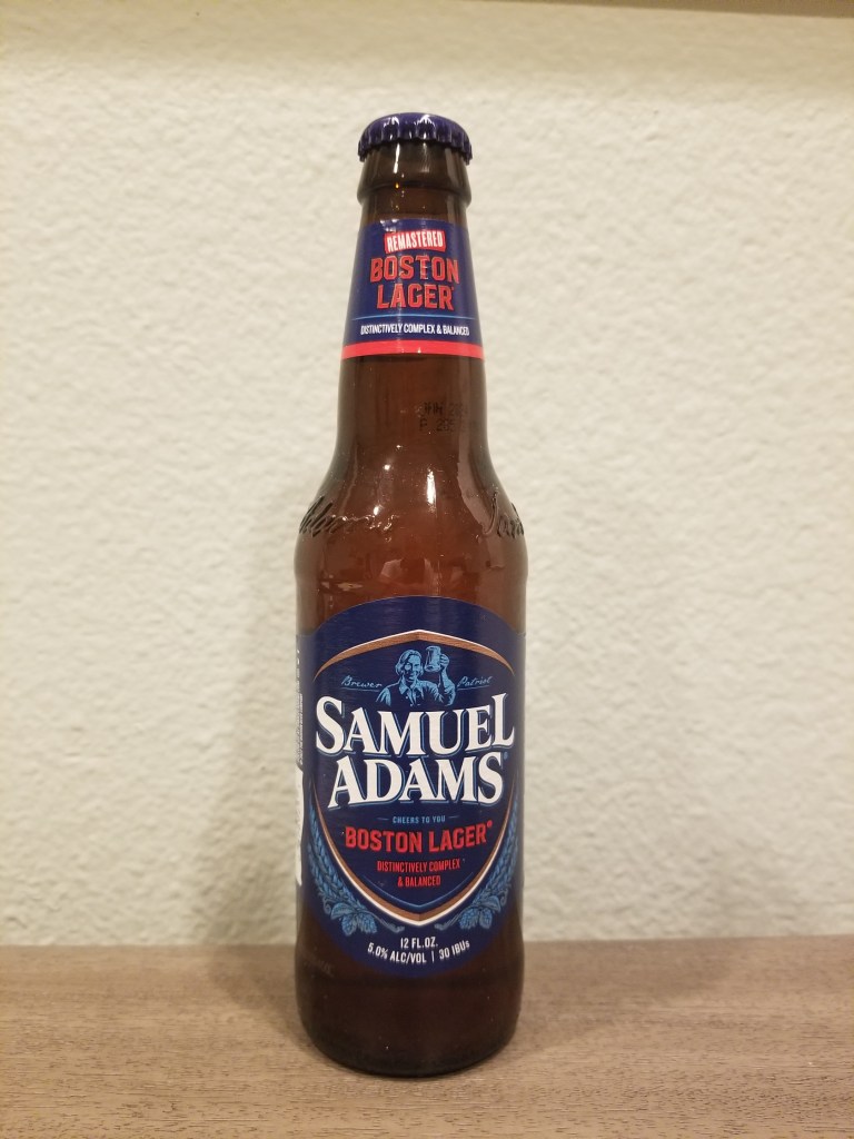 A photo of a bottle of Samuel Adams Remastered Lager.