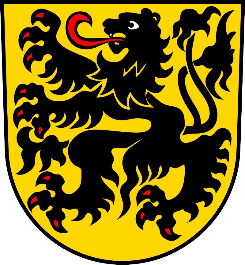coat of arms of the town of Leonberg. A black lion like figure on a yellow background