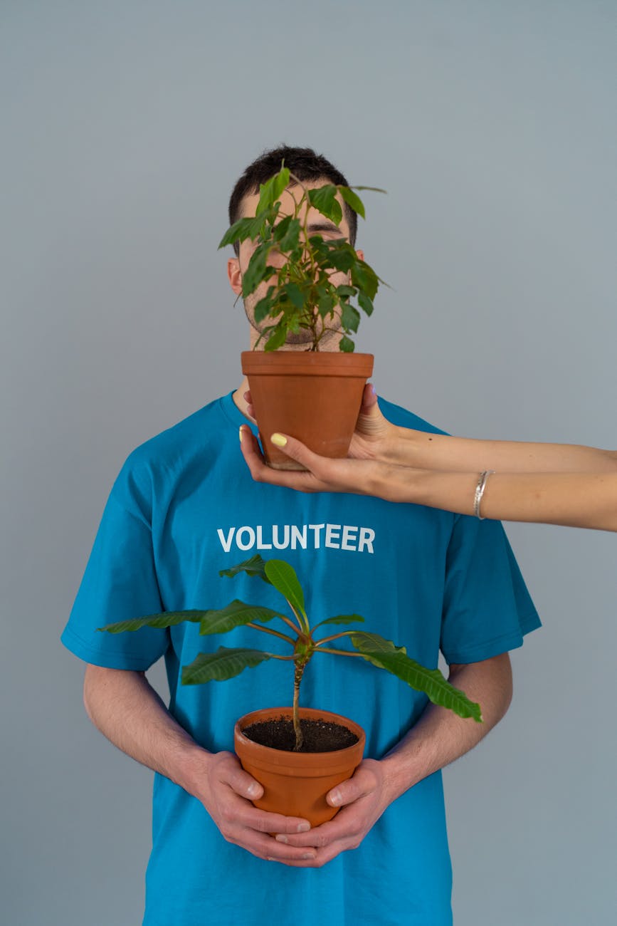A man wearing signs saying volunteer