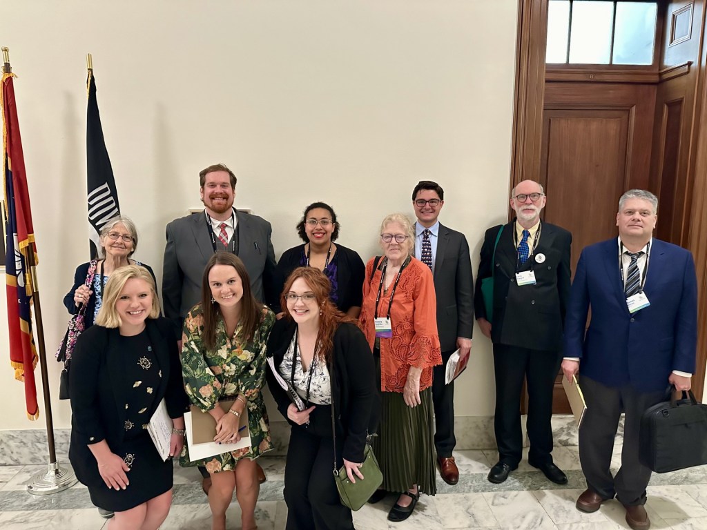 There are 10 people in the photo. Three staff and seven CCL volunteers.