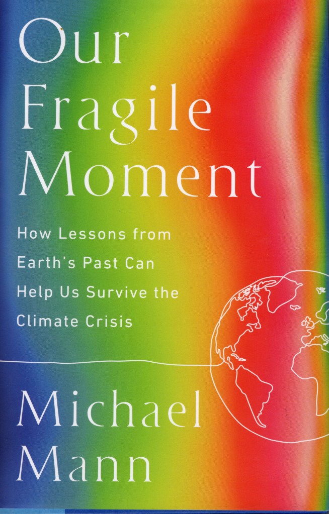 Rainbow background going from blue on the left to red on the right. This illustrates earth’s warming climate.