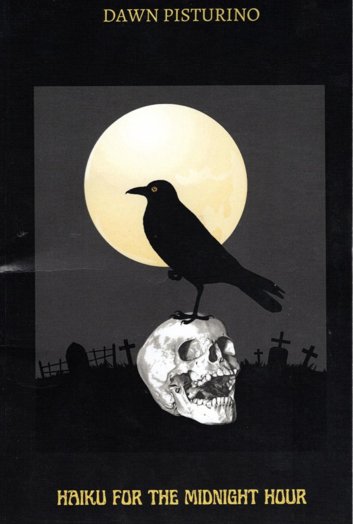 The front cover is black and feature a cemetery, a skull, a full moon and a raven.
