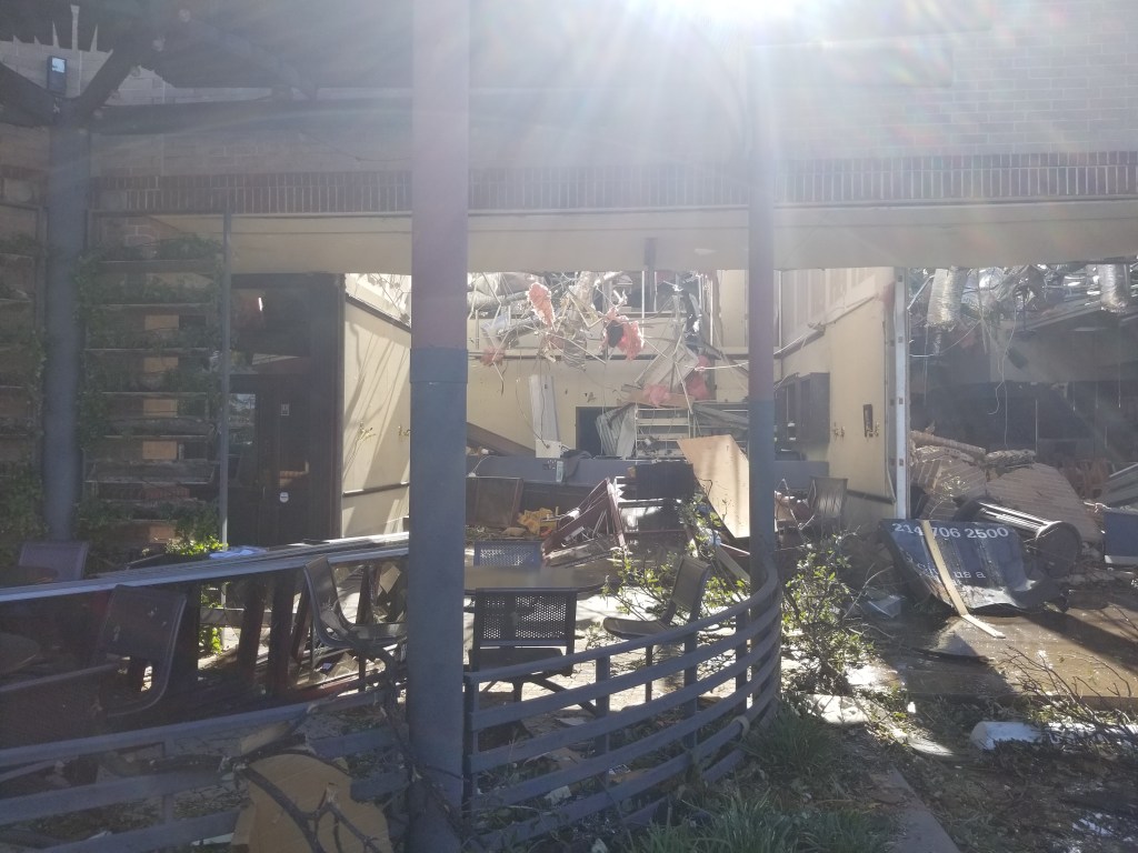 A photo taken from the inside of a destroyed office.