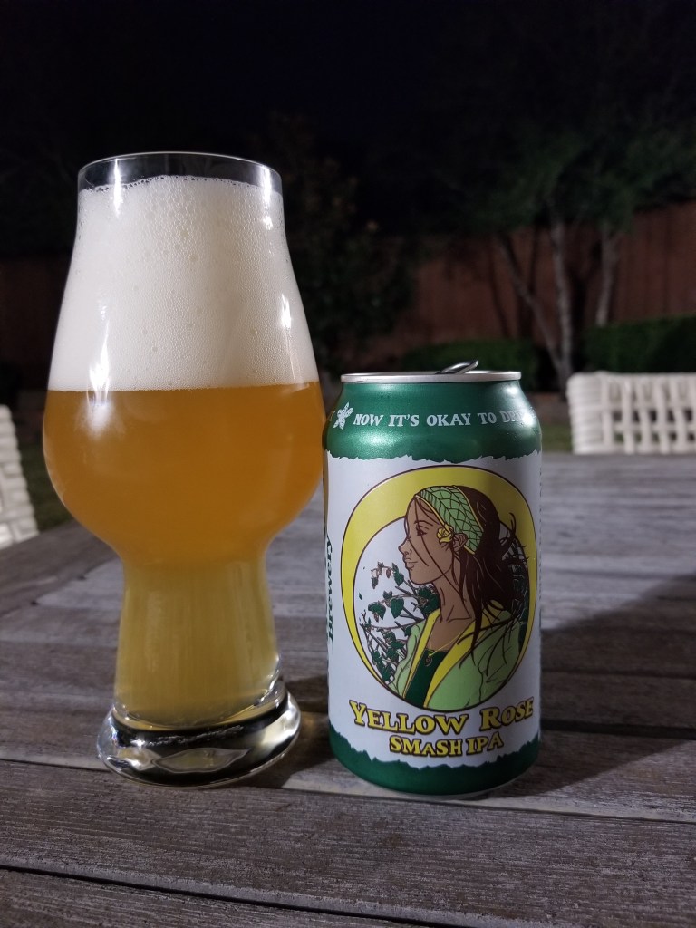 A photo of a beer glass next to a can of Yellow Rose IPA. The beer label shows a young woman in a yellow and green outfit.