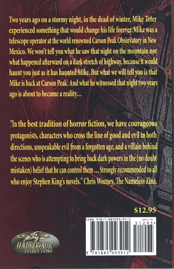 The back cover is black and red and has a description of the book.