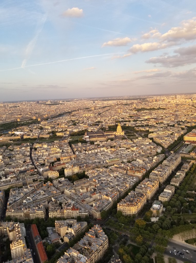 The photo shows thousands of impressive buildings in the distance including Notre Dame and Jardin Du Luxembourg.