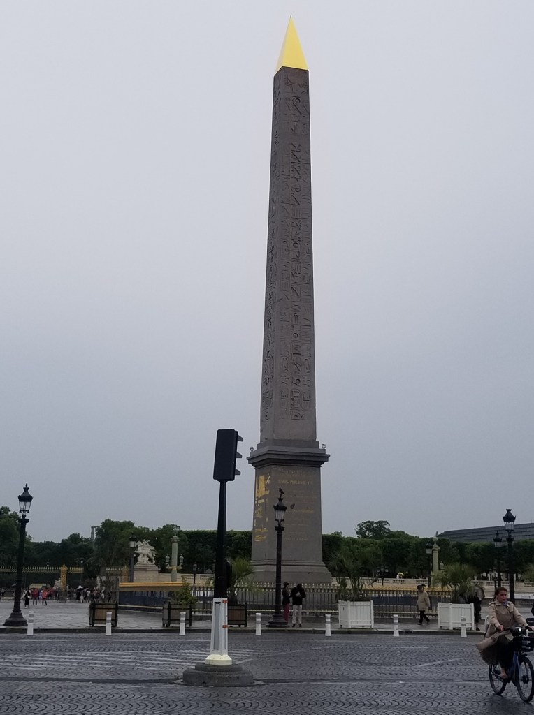 The photo shows an obelix that has a gold-plated pyramid on top.