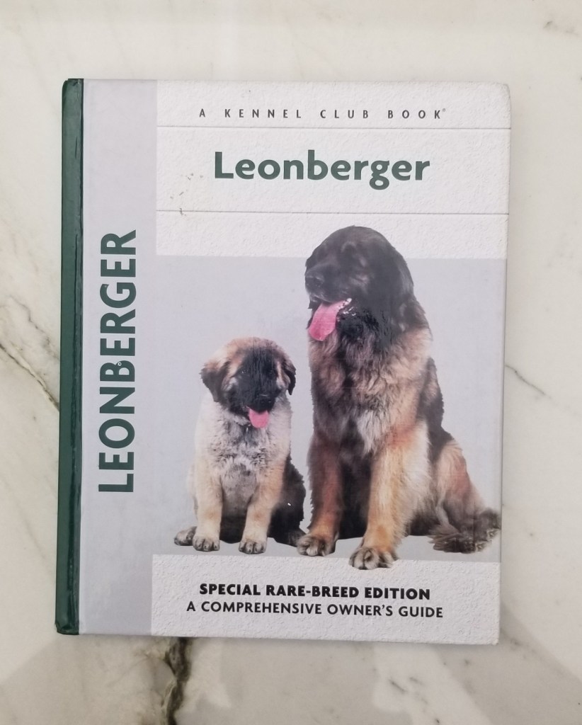 Front cover of the book Leonberger, Special Rare-Breed Edition, A Comprehensive Owners Guide, Madeline Lusby. It features a photo of an adult Leonberger and a puppy Leonberger.