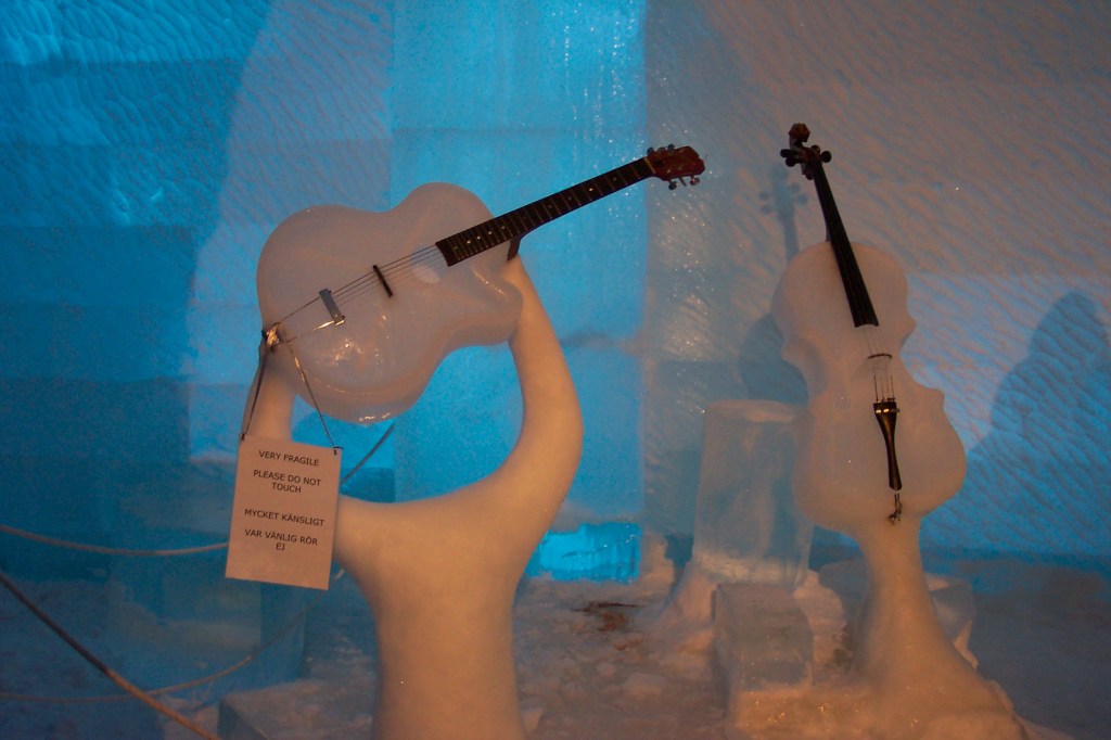 Photo of a beautiful cello and guitar sculpted in ice.