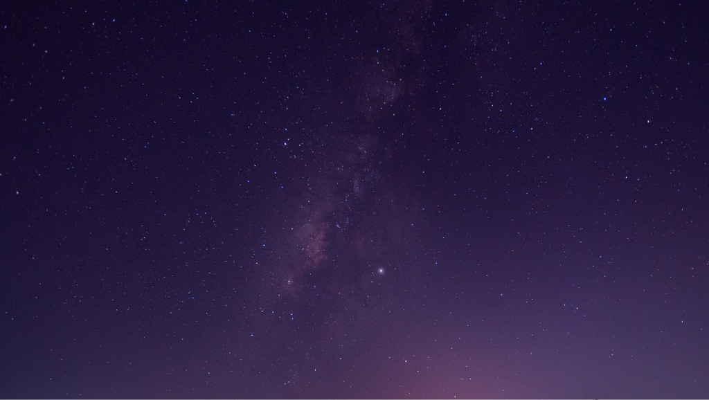Stars in the sky. Blue night panorama, a universe full of stars, nebula and galaxies.