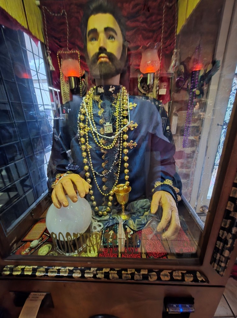 Automated fortune teller in a glass box.