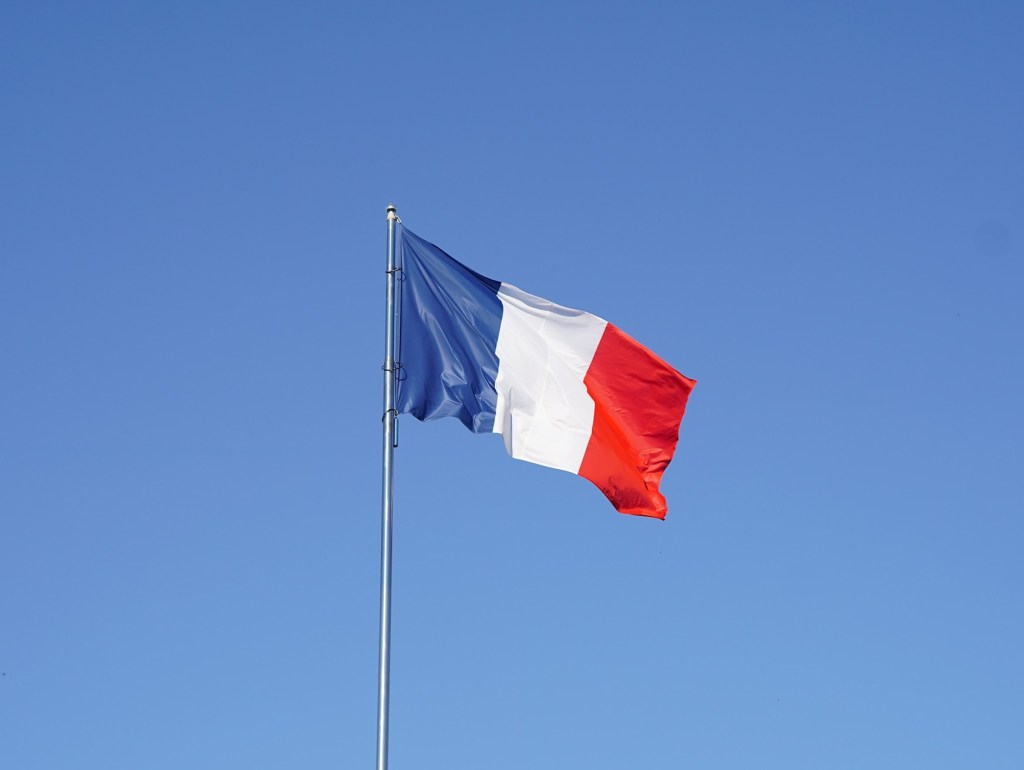 French flag against blue sky