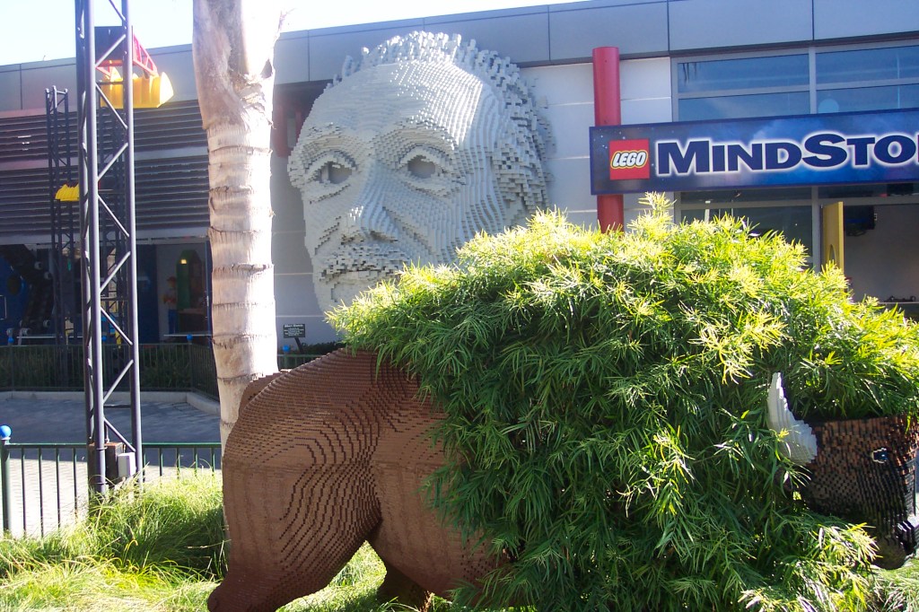 In the background is a Lego Science Center. There is also a Lego Bull in the picture.