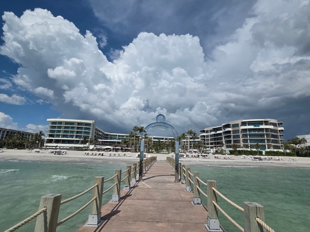 The photo shows buildings in the background, an angry storm cloud that seems to have eyes, and I included an arch in the photo. The arch looks like an angry mouth on the cloud.