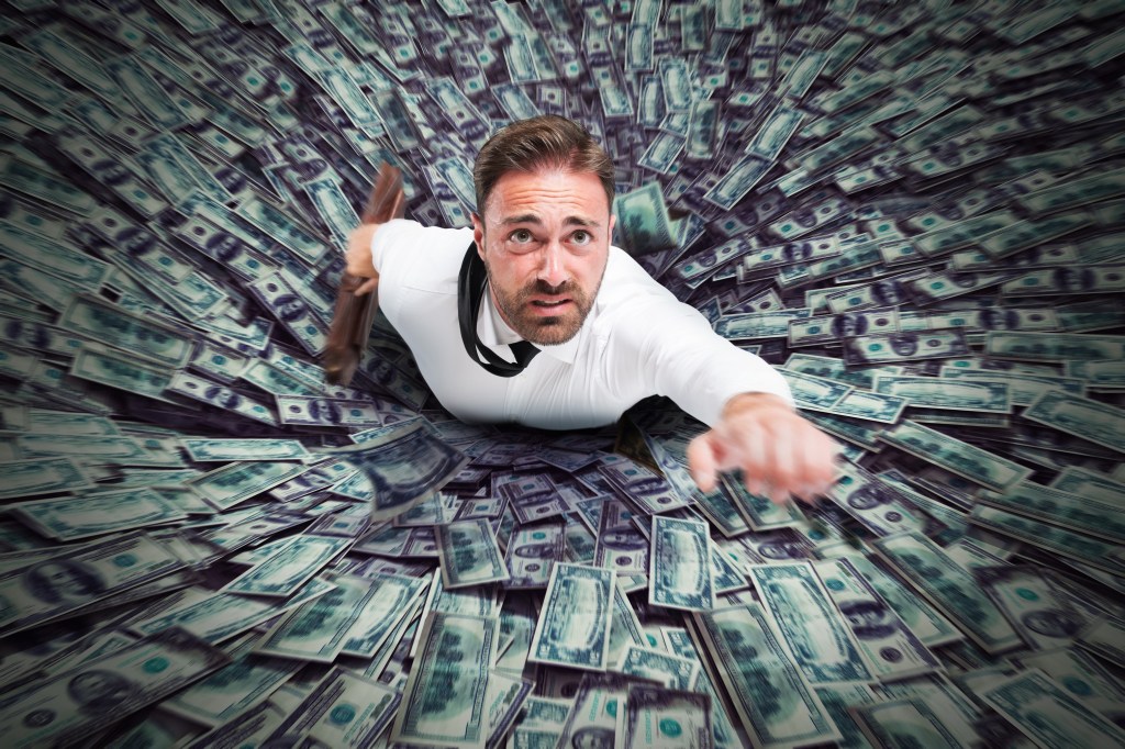 Hole that sucks up a businessman and money.